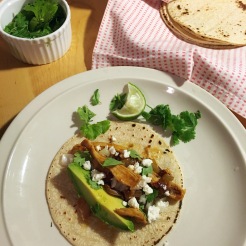 Chicken tacos with chiles in adobo, feta, cilantro, avocado and lime